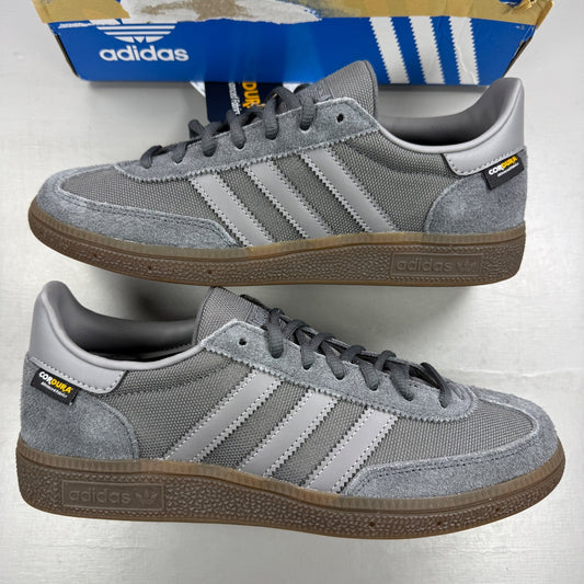 Adidas athletic shoes grey Cordura material with gum sole and logo detail.