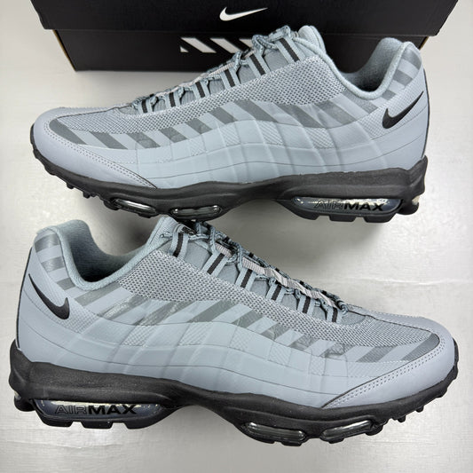 Nike running shoes grey with caution strip detailing and Air Max cushioning.