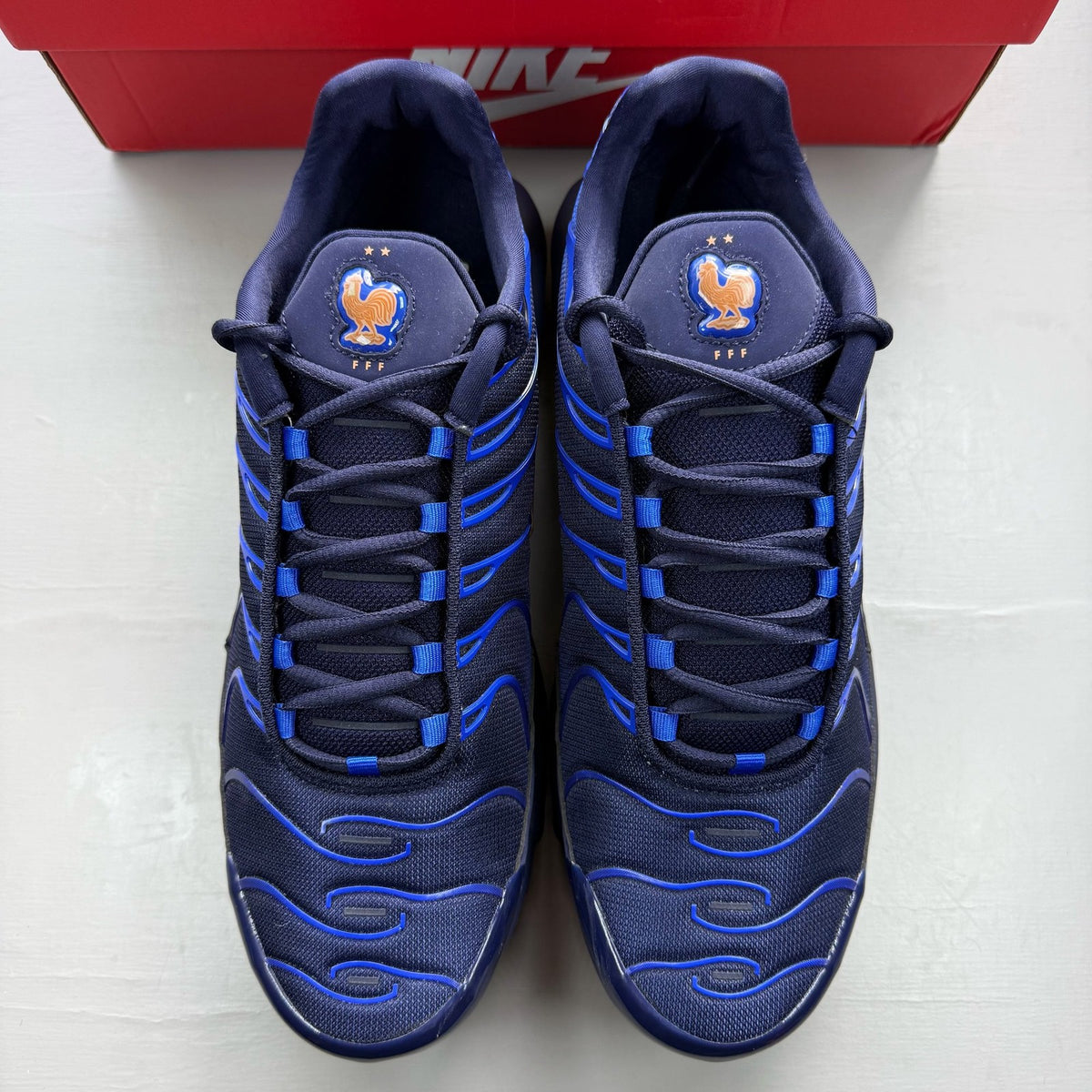 Nike soccer ball blue with French Football Federation logo and textured surface.