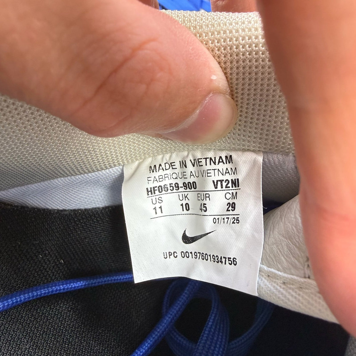 Nike Air Force 1 low trainers white with blue accents and gum sole.