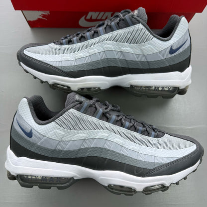 Nike Air Max 95 grey trainers with blue accents and visible logo detailing.