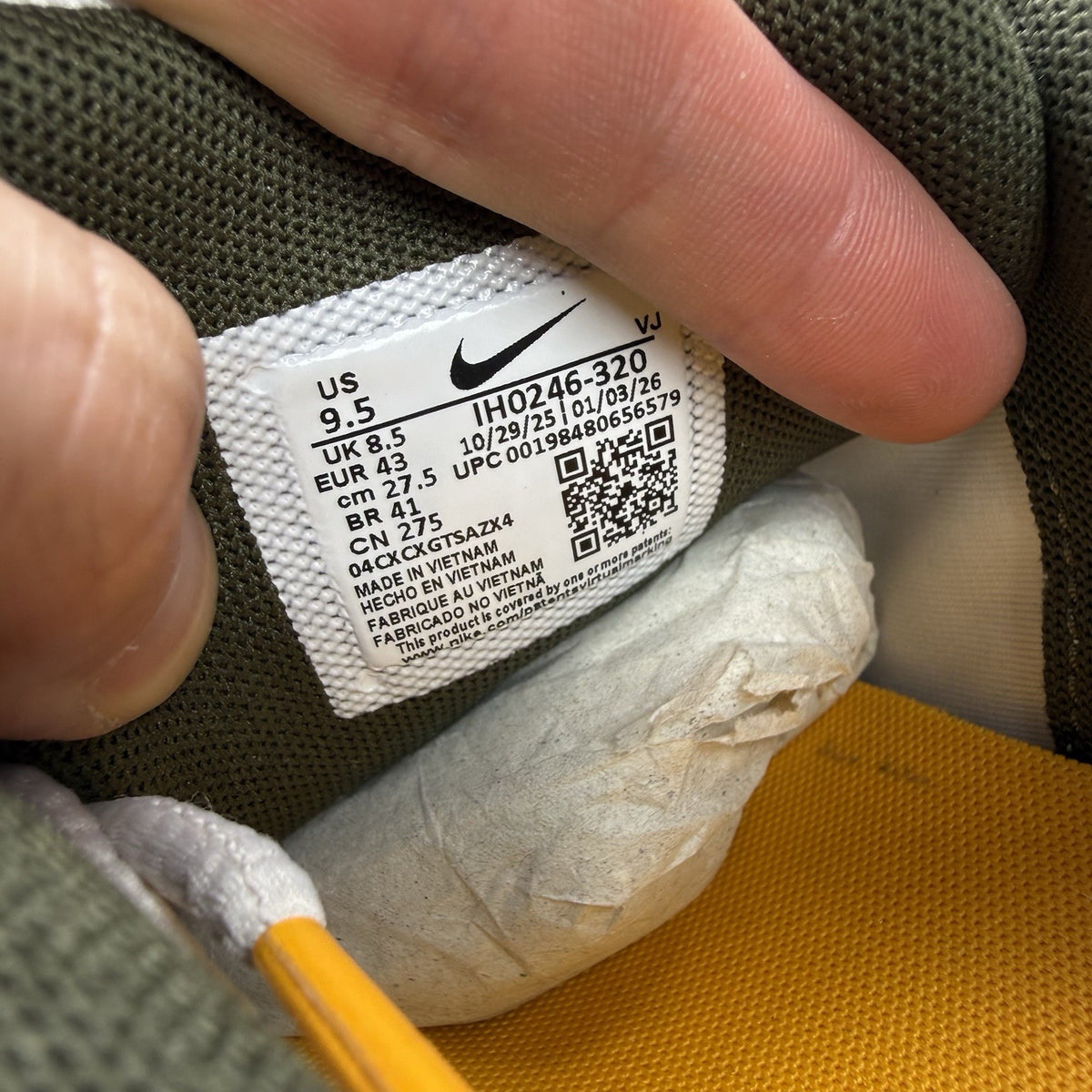 Nike white trainers with light army accents and breathable mesh upper.