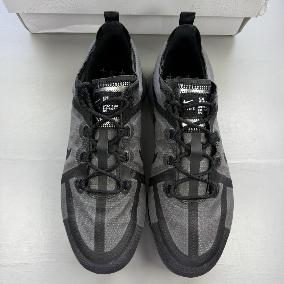 Nike Air VaporMax 2019 black trainers with grey accents and transparent sole design.