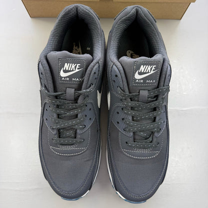 Nike grey trainers with reflective swoosh logo and anthracite detailing.