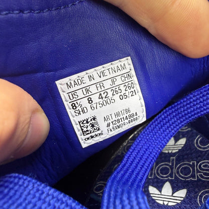Adidas blue deck shoes suede upper with white logo and gum sole.