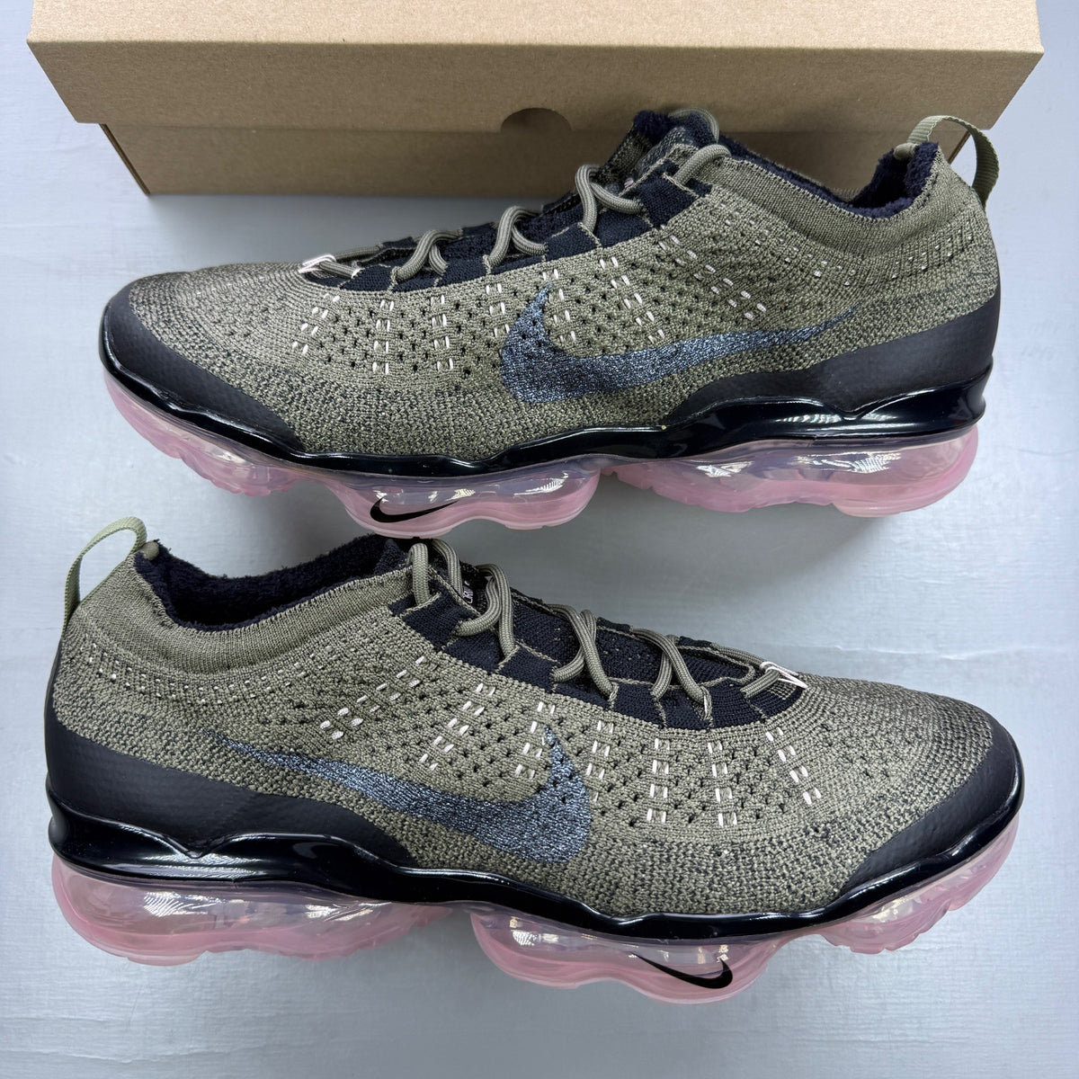 Nike Air VaporMax trainers multi colour Flyknit upper with pink accents and logo.