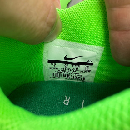 Nike trainers green Flyknit upper with Air Max cushioning and logo detail.