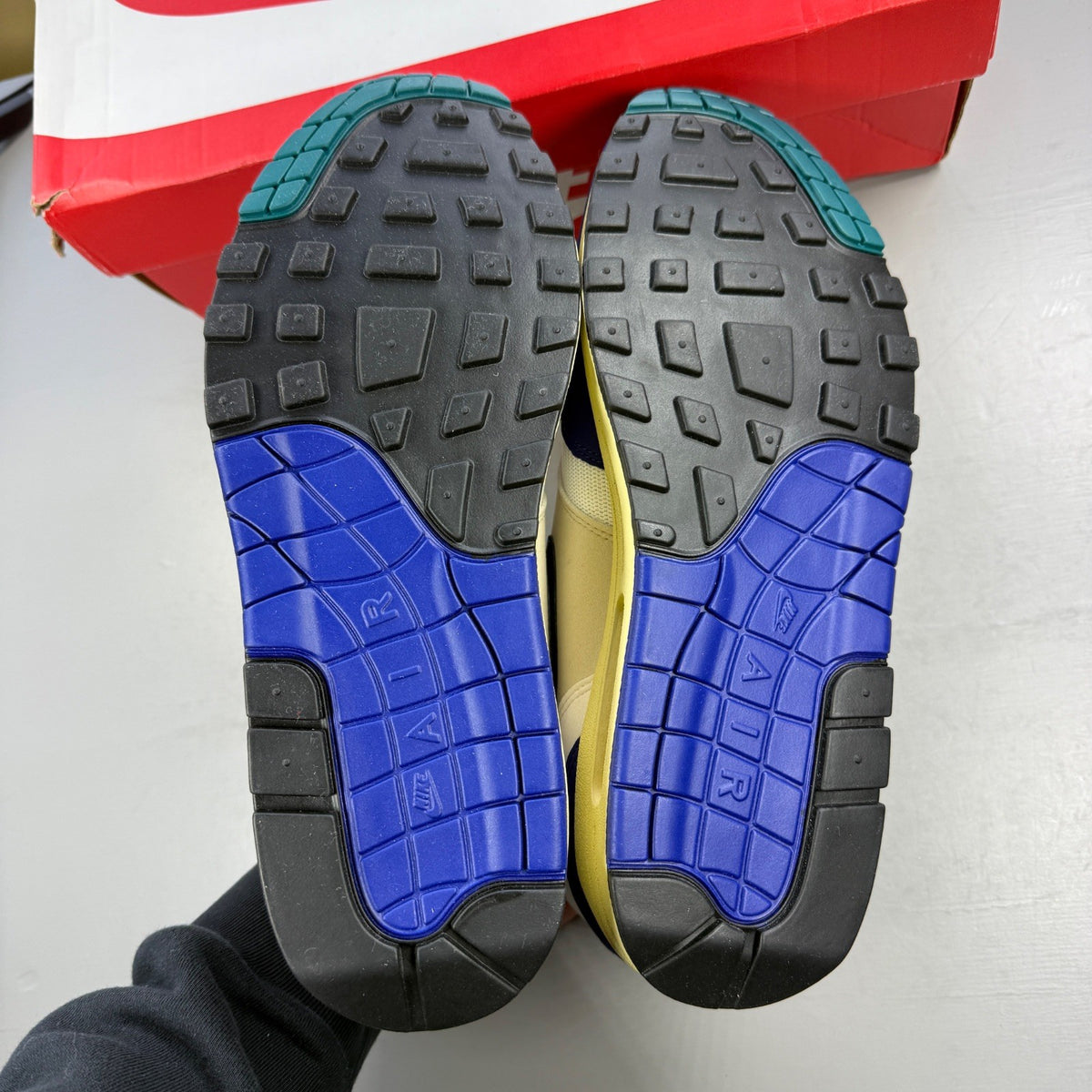 Nike athletic shoes royal blue with white swoosh logo and mesh detailing.
