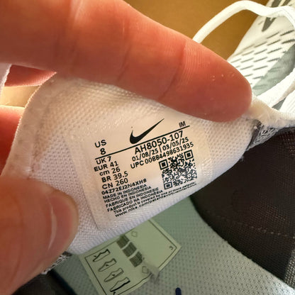 Nike Air Max 270 white trainers with Persian Violet accents and logo detail.