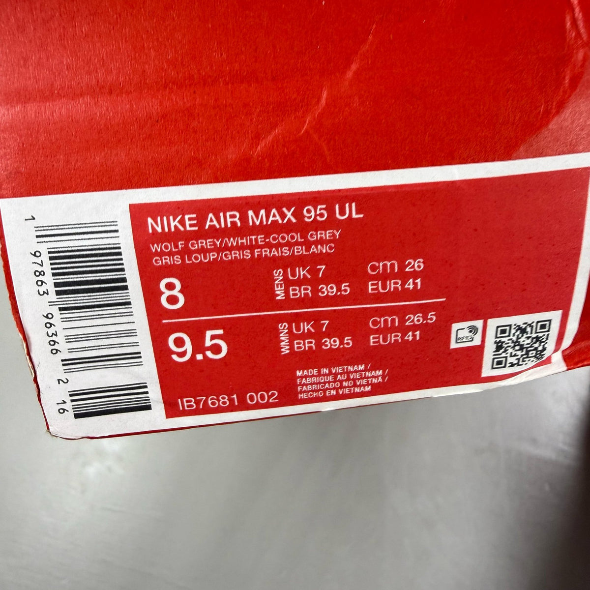 Nike Air Max 95 Ultra white trainers with grey accents and signature logo details.
