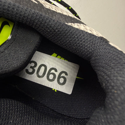 Nike deck shoes black grey with volt accents and signature logo details.