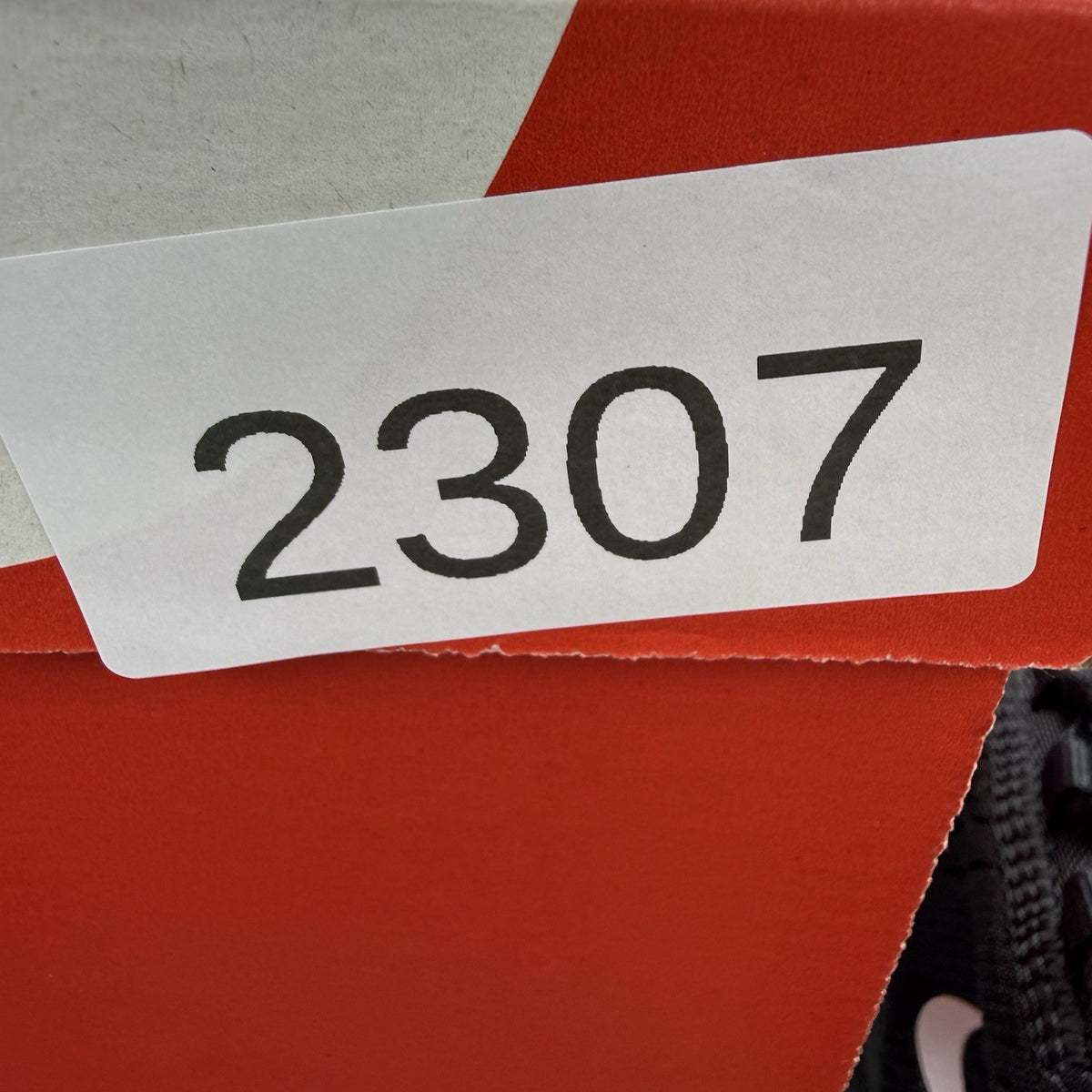 Nike Air Max 270 black trainers with neon volt accents and white sole.