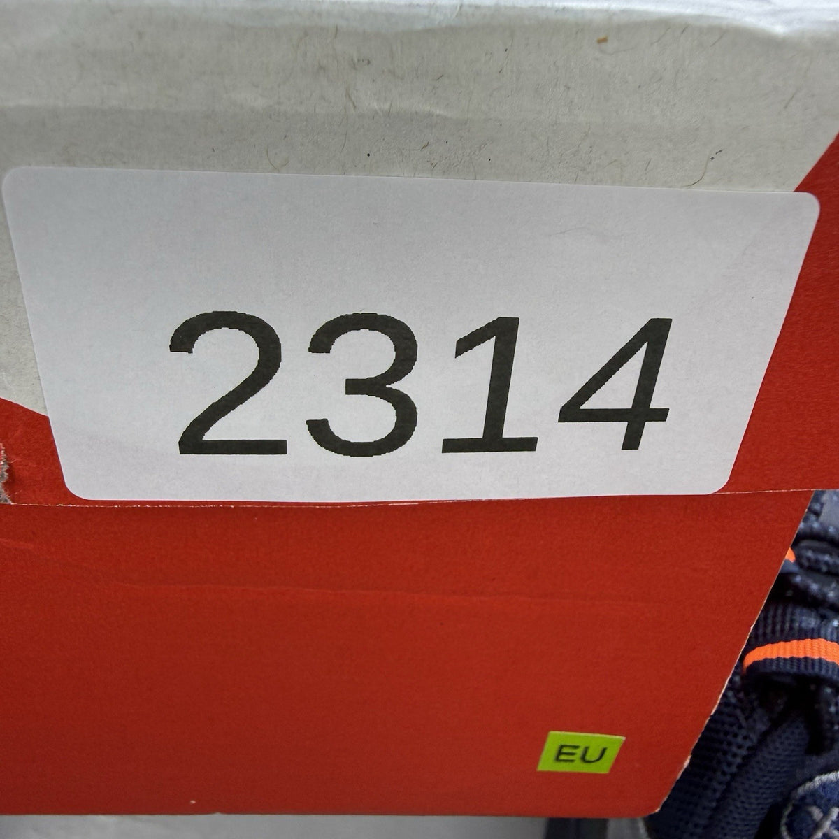 Nike Air Max 95 trainers navy blue with orange accents and anthracite grey details.