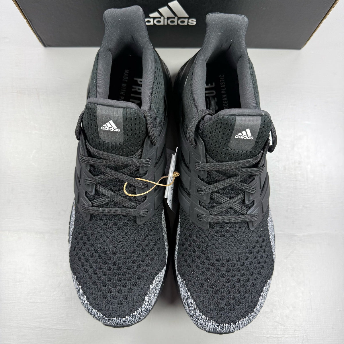 Adidas black Ultra Boost 1.0 trainers with core black and oreo toe design.
