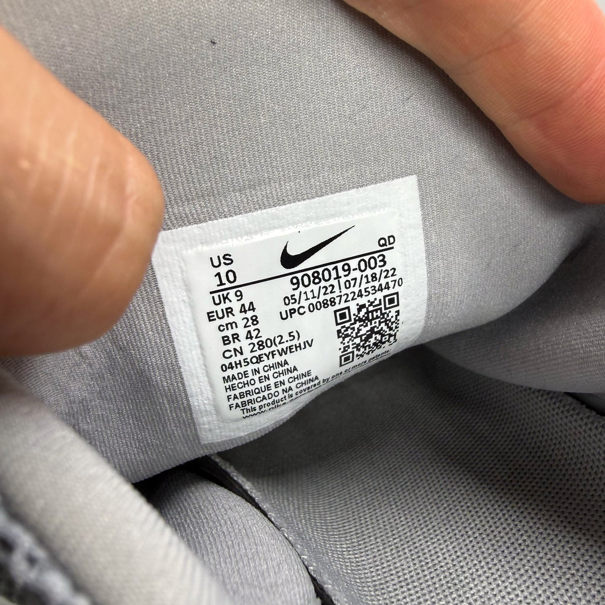 Nike Presto Fly grey trainers with white accents and logo detail.