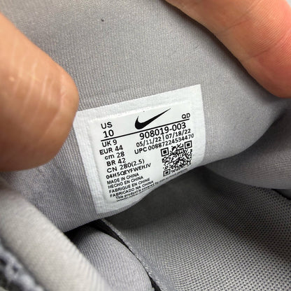 Nike Presto Fly grey trainers with white accents and logo detail.