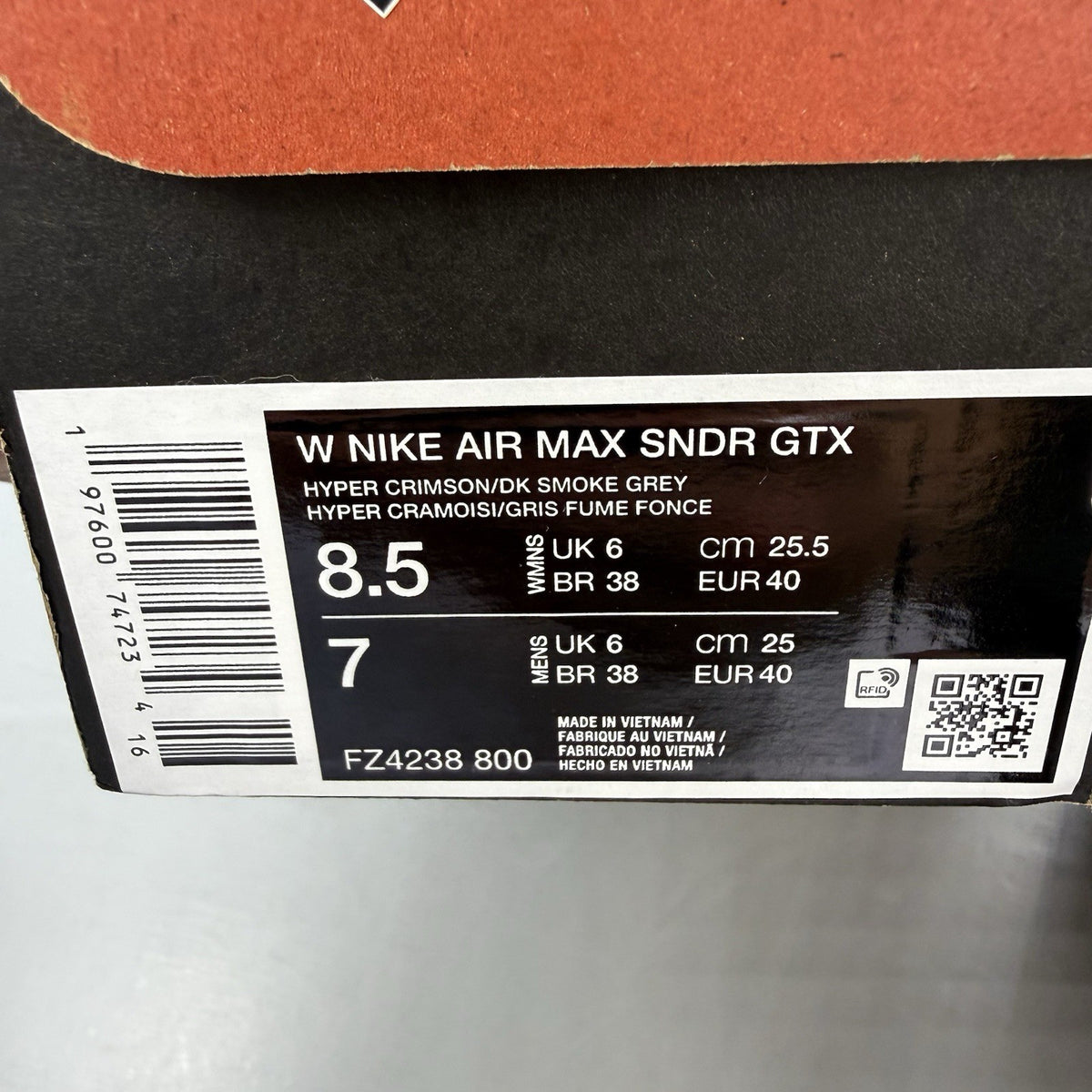 Nike black trainers with Hyper Crimson accents and Gore-Tex material.