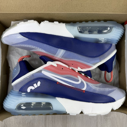 Nike Air Max 2090 trainers white with red and blue accents, featuring logo details.