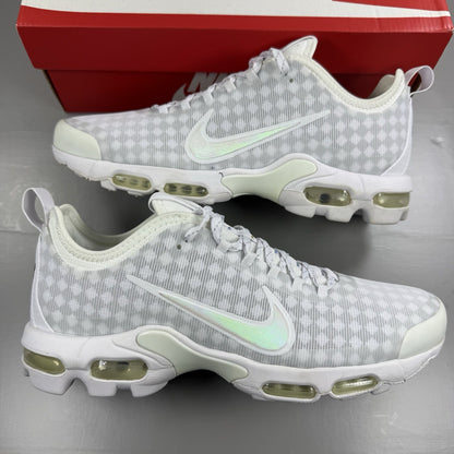 Nike Air Max Plus TN Ultra white trainers with reflective accents and signature swoosh logo.