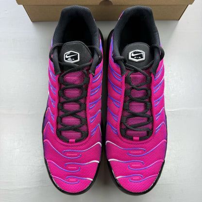 Nike Air Max Plus TN pink and purple trainers with distinctive wave pattern and logo.