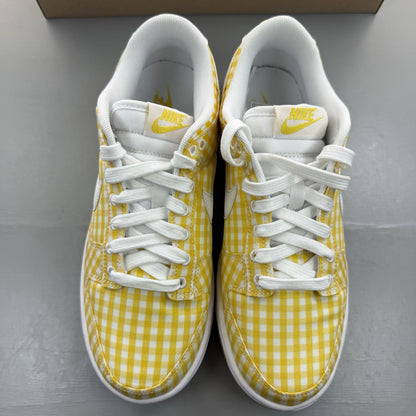 Nike Dunk Low white trainers with yellow gingham pattern and brown gum sole.