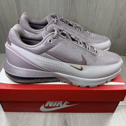 Nike Air Max Pulse purple trainers with unique design and textured material.