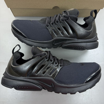 Nike Air Presto black trainers with logo detailing and breathable mesh upper.