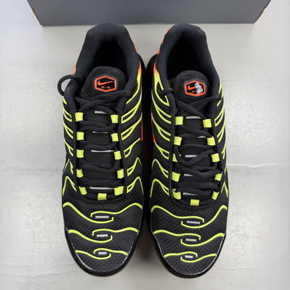 Nike Air Max Plus TN black with vibrant limelight and hyper crimson accents.