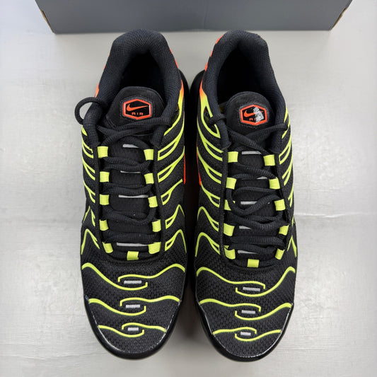 Nike Air Max Plus TN black with vibrant limelight and hyper crimson accents.
