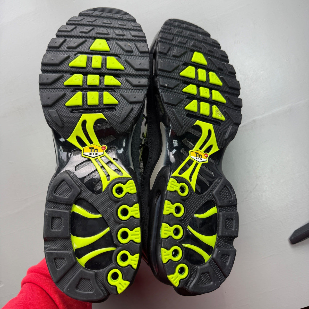 Nike deck shoes black grey with volt accents and signature logo details.