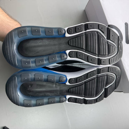 Nike Air Max 270 white trainers with laser blue accents and logo detail.