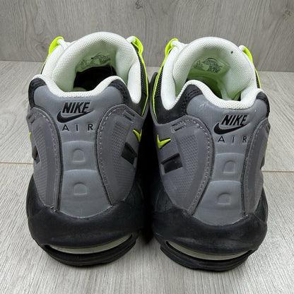 Nike Air Max 95 NDSTRKT black trainers with neon accents and textured mesh upper.