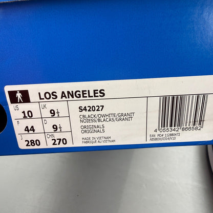 Adidas black deck shoes with white stripes and logo, brand new in box.