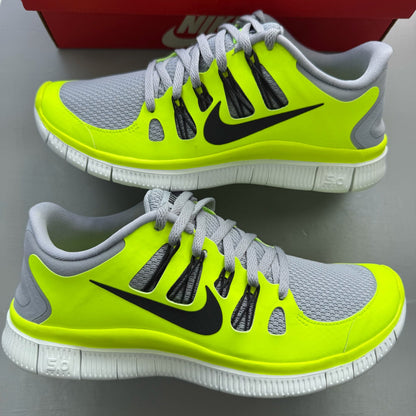 Nike grey trainers with black accents and distinctive Free 5.0 design.