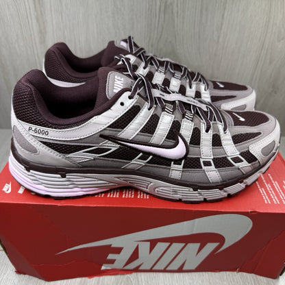 Nike P-6000 trainers purple with pink accents and mesh material detailing.