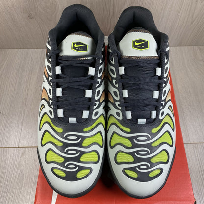 Nike Air Max Plus TN trainers silver with volt accents and signature logo details.