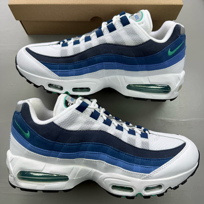 Nike Air Max 95 white trainers with big bubble design and emerald accents.