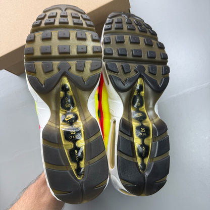 Nike black Air Max 95 trainers with hidden message detail and sleek design.
