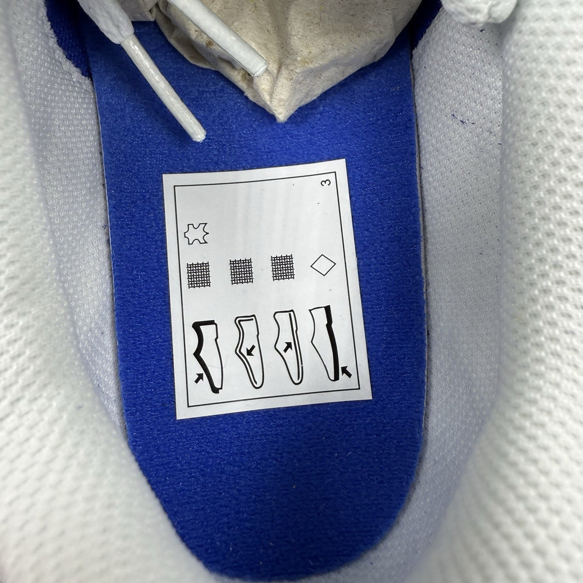 Nike blue trainers with white swoosh logo and mesh upper details.