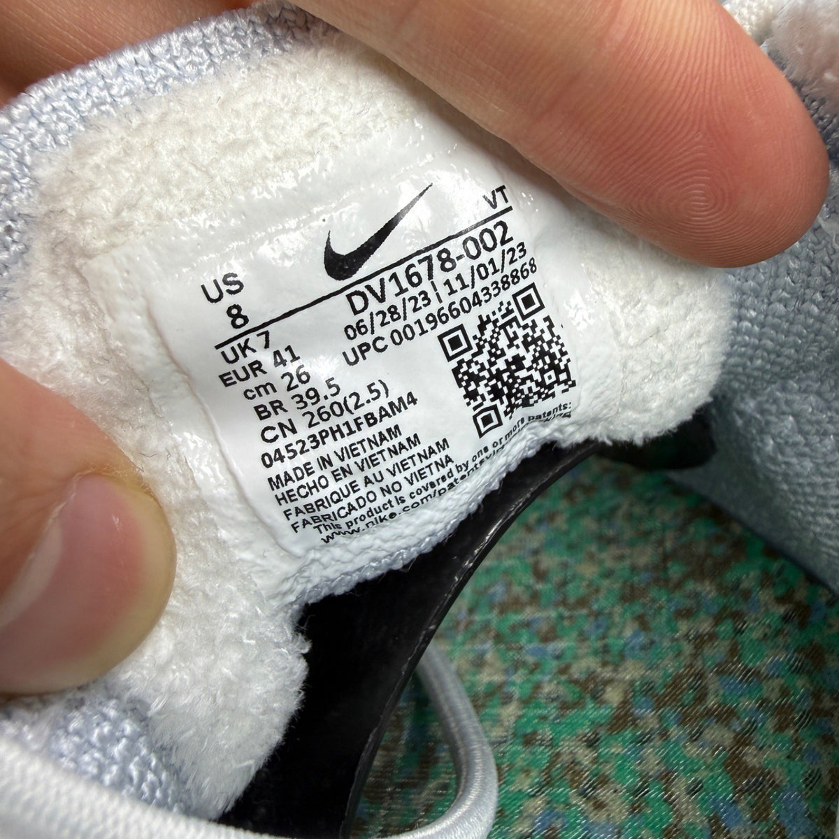 Nike trainers white Flyknit upper with Air cushioning and logo detail.