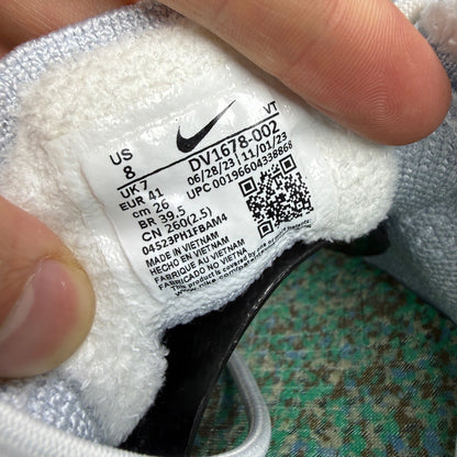 Nike trainers white Flyknit upper with Air cushioning and logo detail.