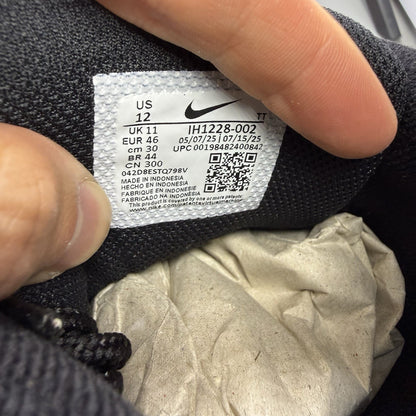 Nike Air Max 95 trainers black with grey and green accents, featuring signature logo.
