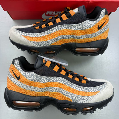 Nike Air Max 95 black trainers featuring unique safari print and signature logo.