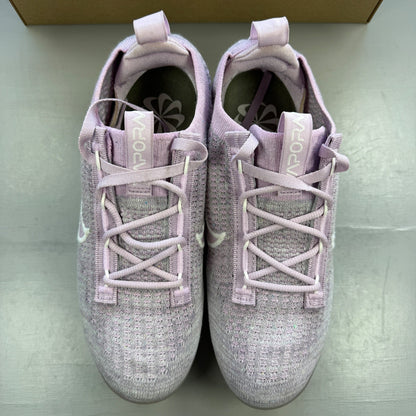 Nike trainers pink Flyknit upper with Air cushioning and logo detail.