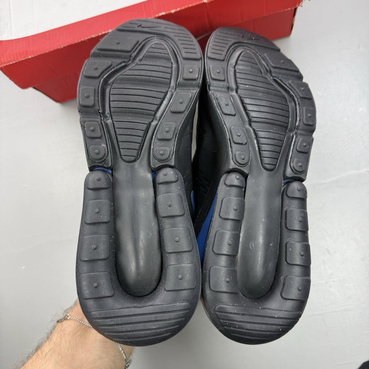 Nike Air Max 270 black trainers with multi-swoosh logo and Marina Blue accents.