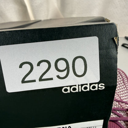 Adidas UltraBoost 1.0 DNA red trainers with signature three stripes and knit upper.