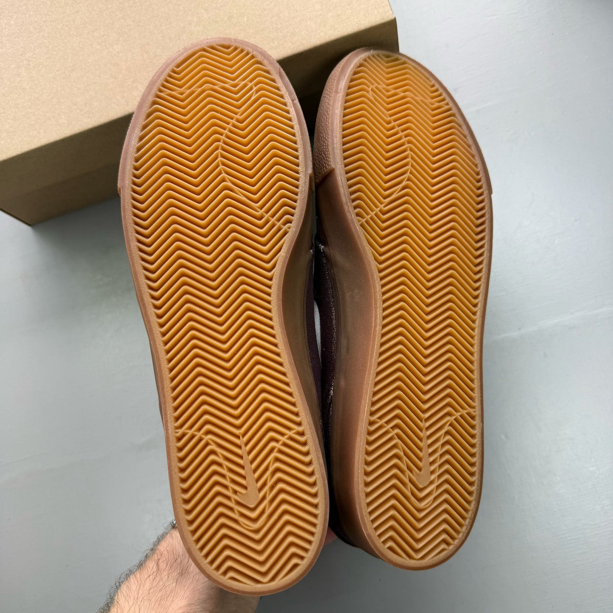Nike SB Stefan Janoski burgundy trainers with gum sole and white accents.