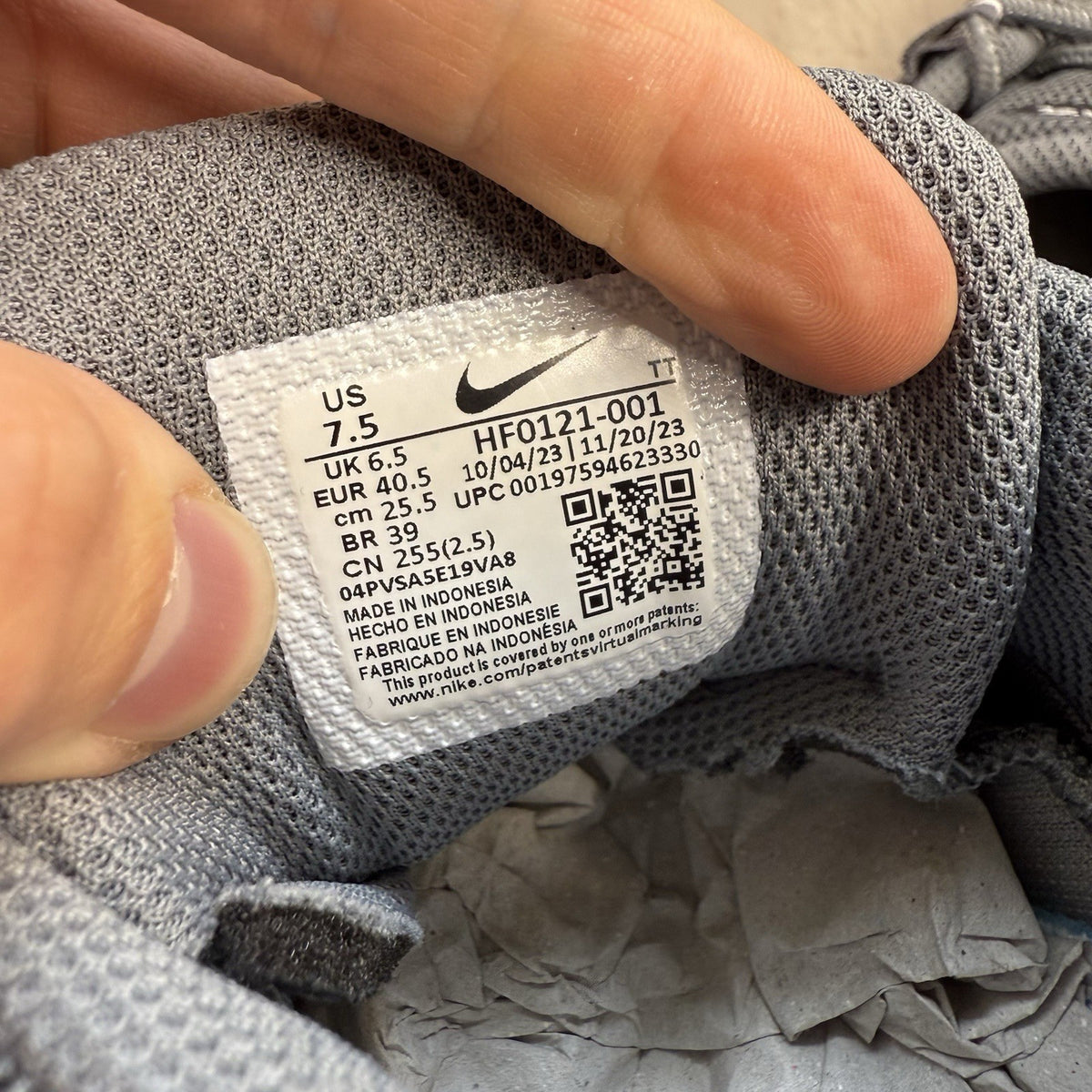 Nike Air Max 95 trainers grey with black accents and textured material.