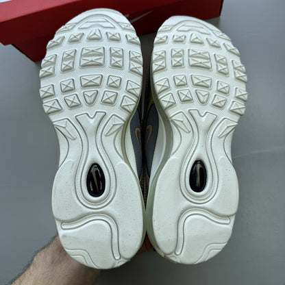 Nike Air Max 97 SE metallic silver trainers with bronze accents and white sole.
