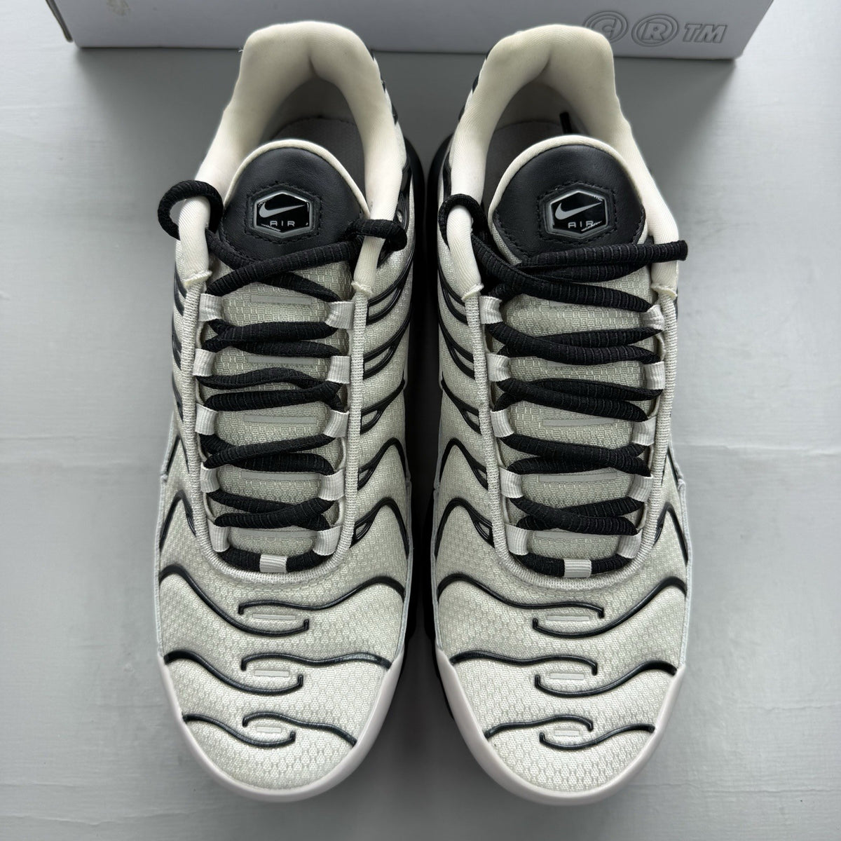Nike Air Max Plus TN white trainers with black and purple accents, custom writing on bubbles.